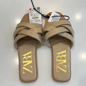 Brand new, never worn natural color leather slides